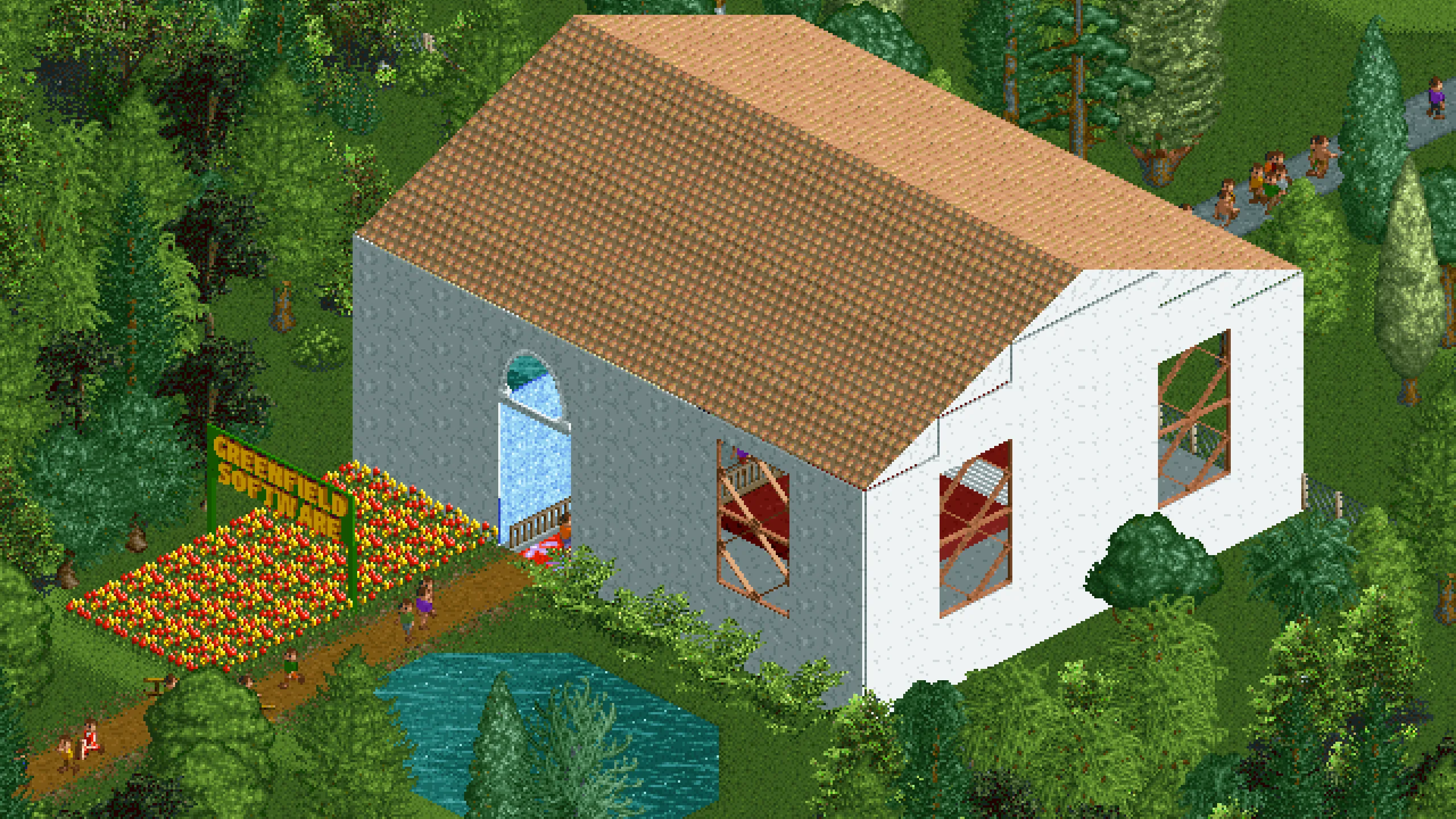 A small house. A sign in front of the house says “Greenfield Software”. The door is wide open.